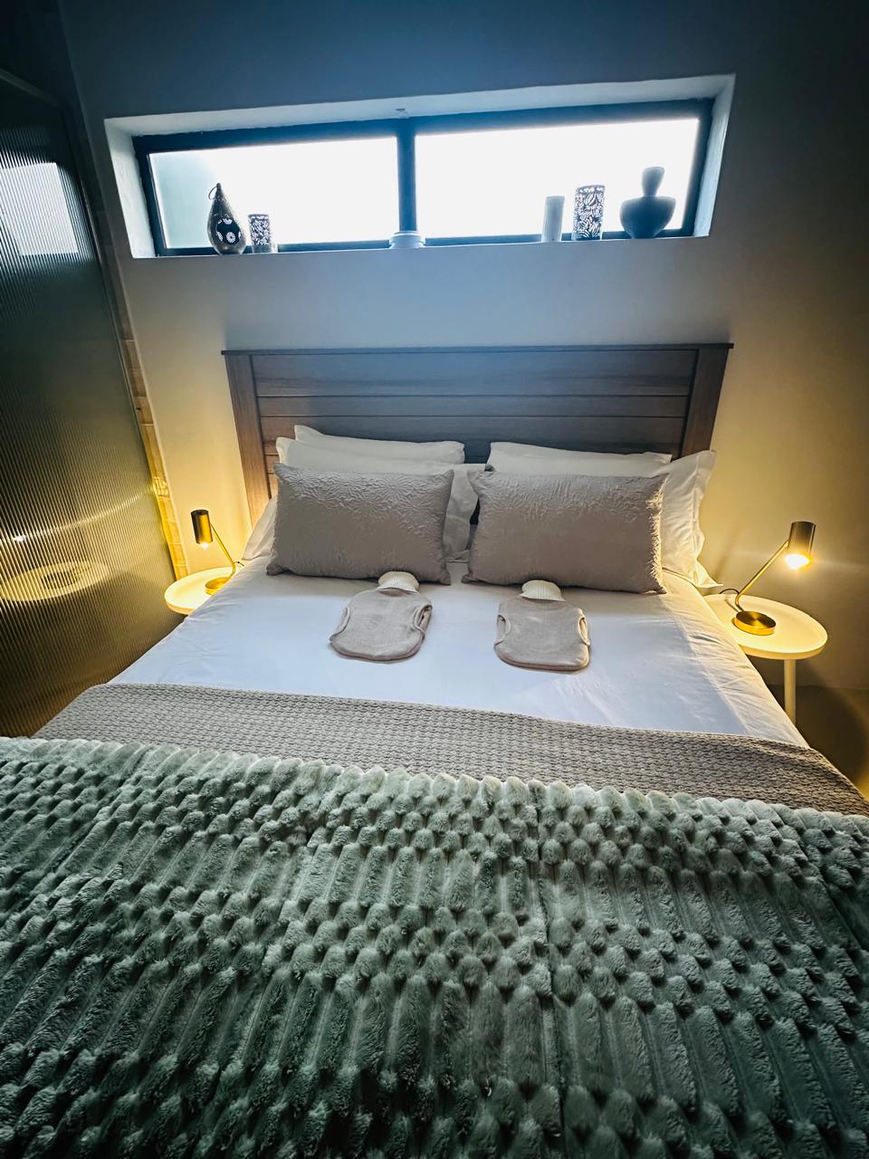 Cozy winter bedroom setup with warm lighting and throws